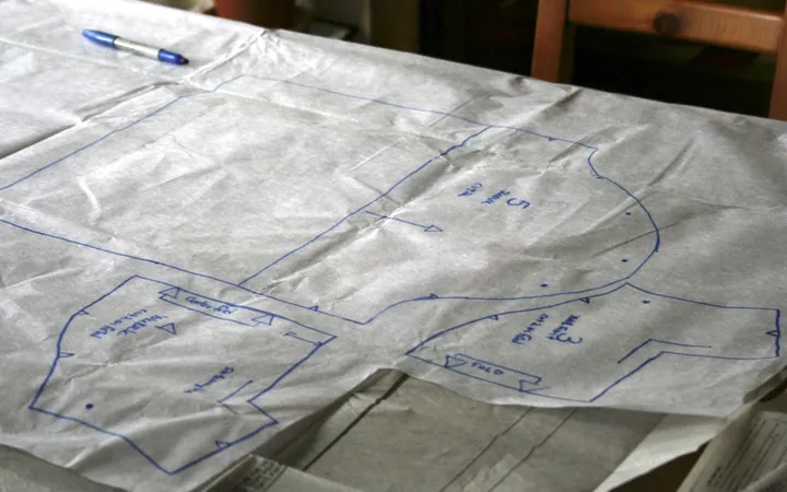 Hand-drawn sewing pattern pieces on tracing paper